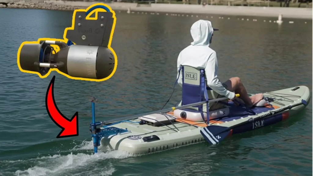 Bixpy K-1 motor highlighted with arrow showing installation on an inflatable kayak