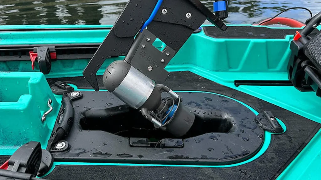 Bixpy K-1 motor installed in the center hatch of a teal fishing kayak