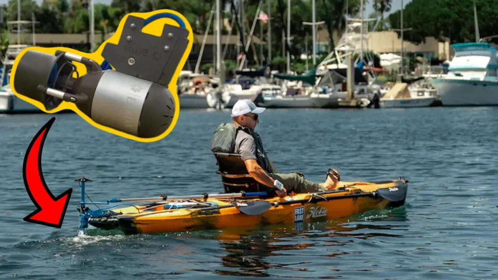 Bixpy motor highlighted with arrow showing installation on a yellow fishing kayak in a marina