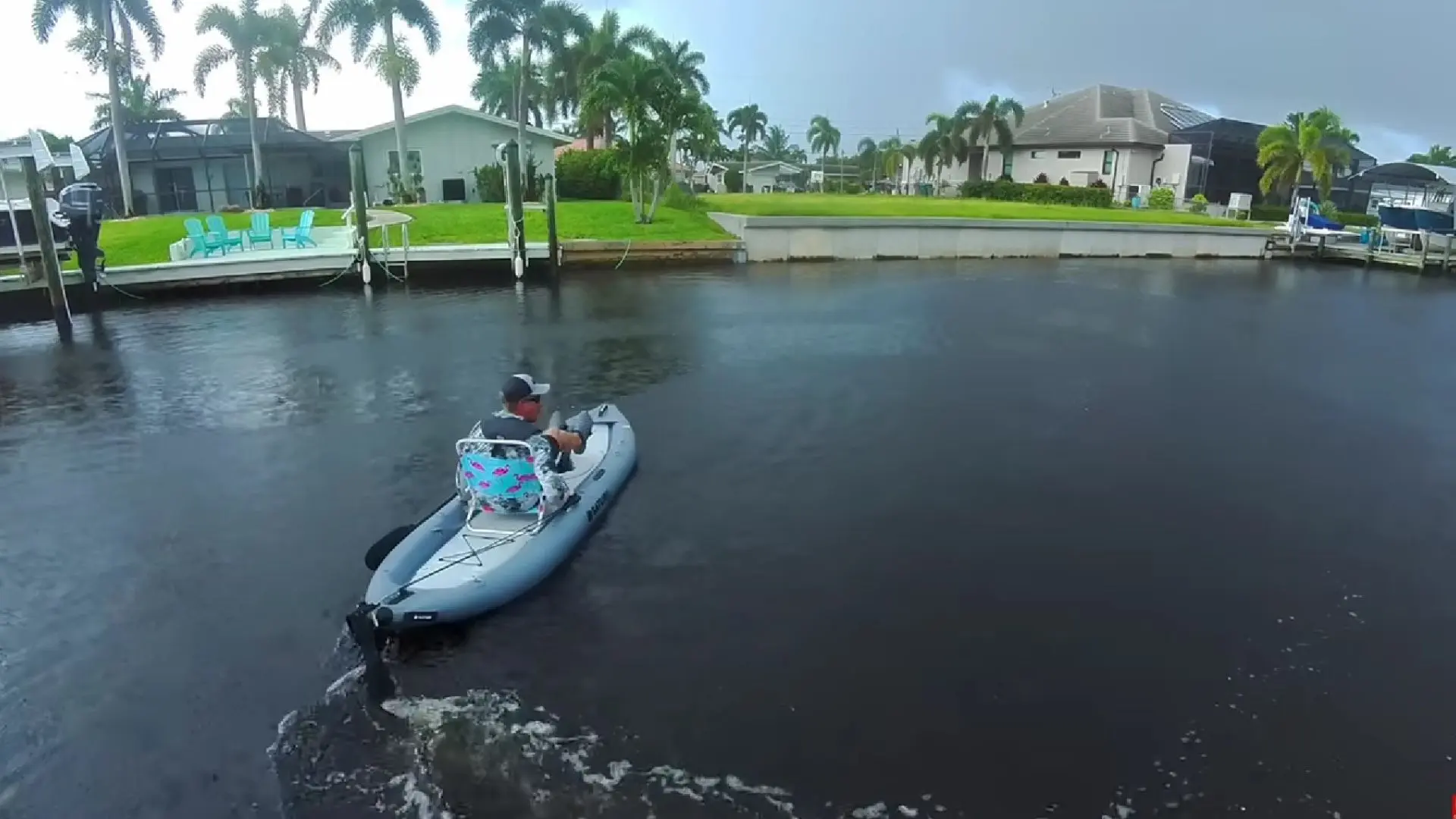 Saturn FPK365 inflatable pedal kayak being paddled on a residential canal during an on-water test.