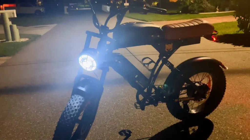 Cycrown Run Pro electric bike photographed at night with headlight on during real-world riding test