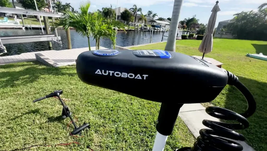 Overhead view of the AutoBoat smart head conversion unit, showcasing the branding and sleek black design.