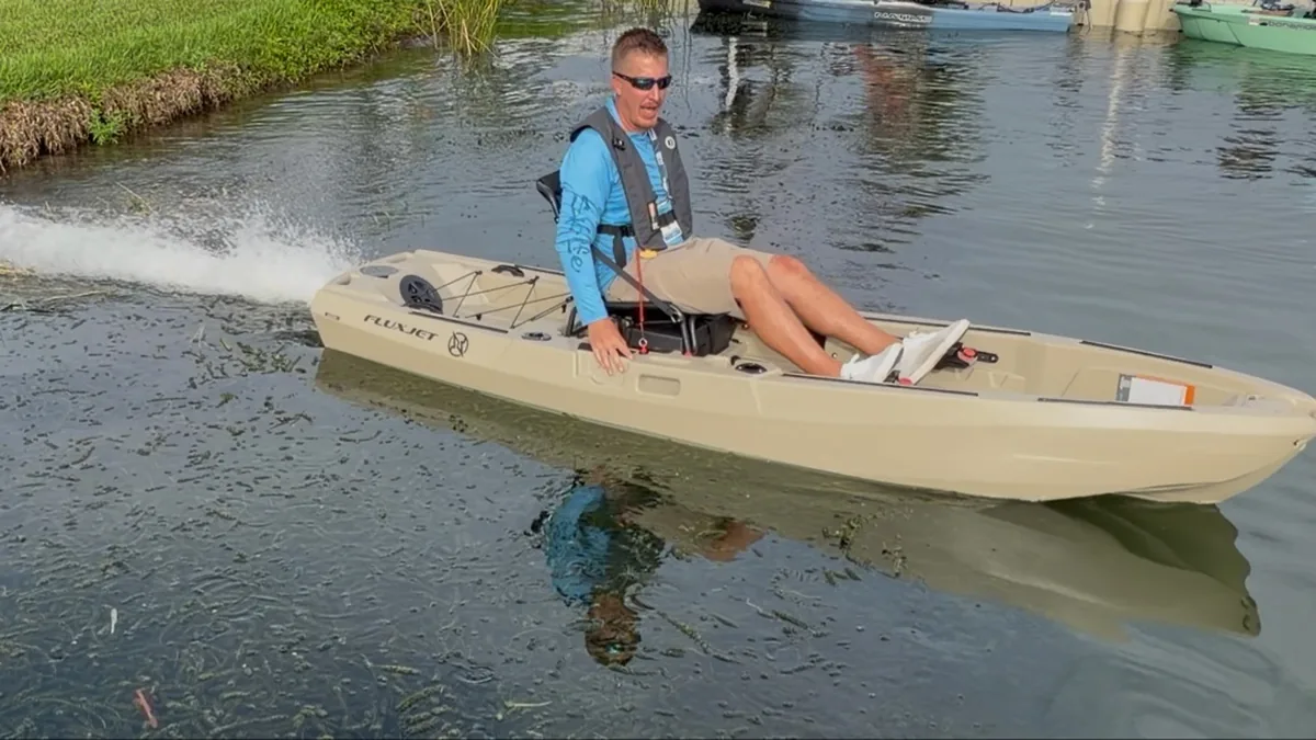 FluxJet electric kayak jet drive spraying water while cruising