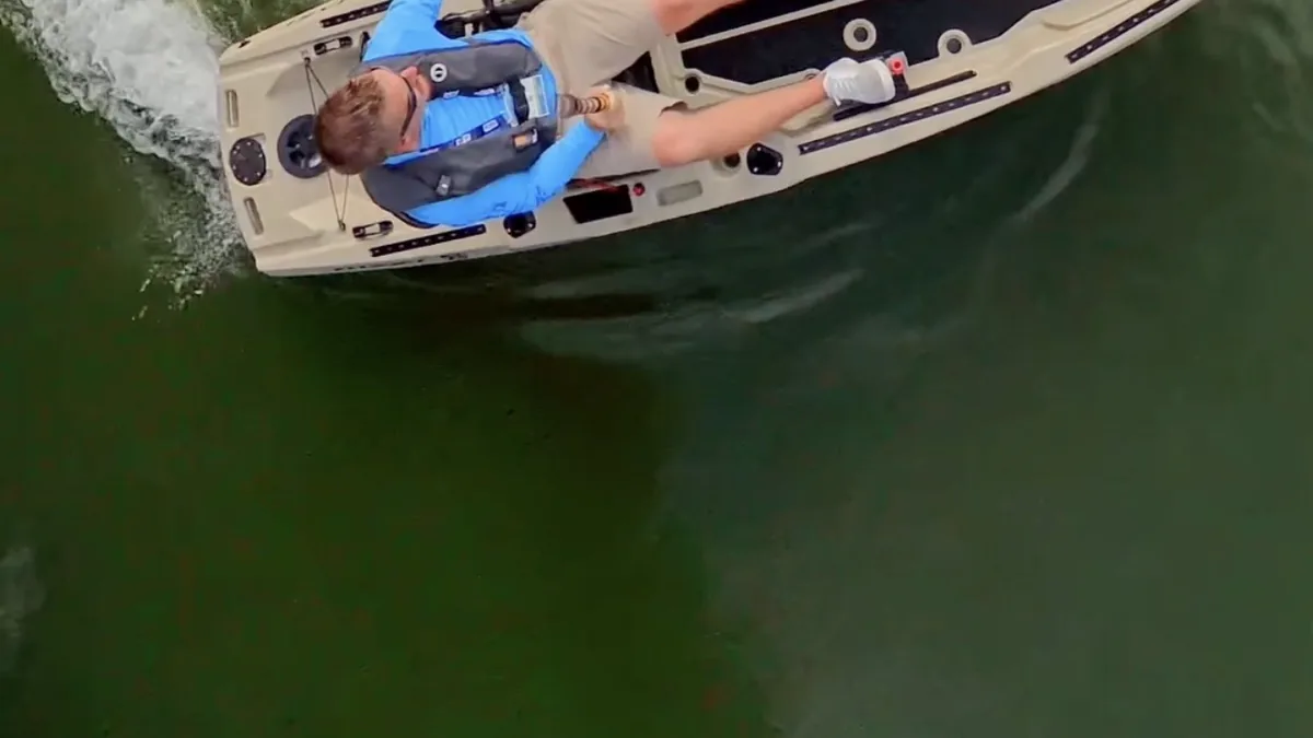 FluxJet Kayak Review: Weed-Ready Electric Jet Power Without an Exposed Prop 8 Aerial view of an angler relaxing in a FluxJet electric kayak