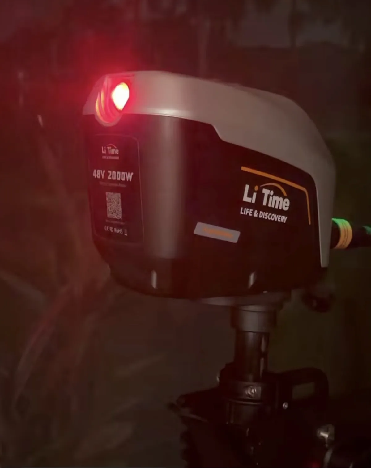 LiTime ArgoSeeker A2 Review 4 LiTime ArgoSeeker A2 navigation light glowing red on the motor cowling at night