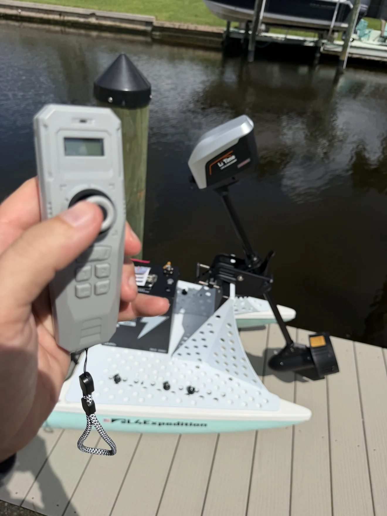 LiTime ArgoSeeker A2 Review 6 Justin holding the LiTime ArgoSeeker A2 wireless remote with the motor mounted behind it